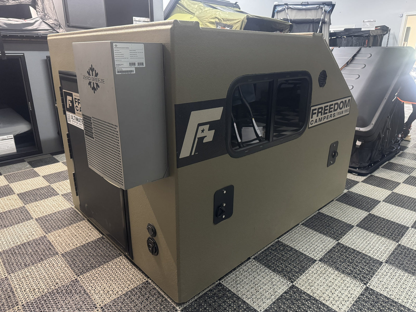 Pre-Owned Freedom Camper 58x79 Tan - side view with Zero Breeze Summit wall-mount AC and heater