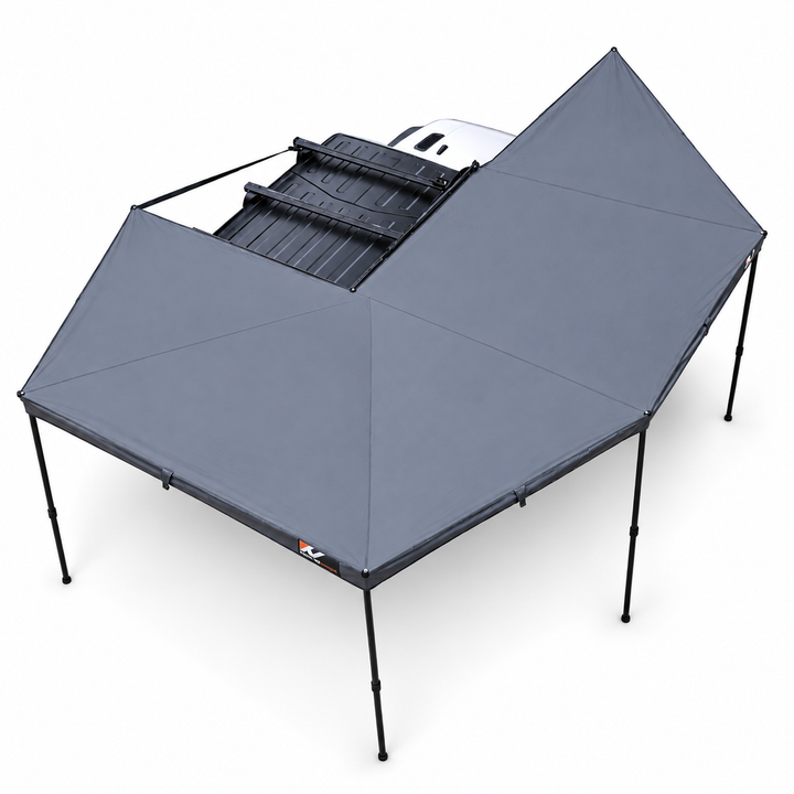 Naturnest 270 Plus X-TEND Awning deployed with support poles, studio view