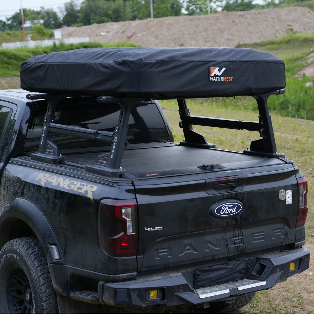 Naturnest Sirius Rooftop Tent Cover fitted on a rooftop tent, rear view of the vehicle