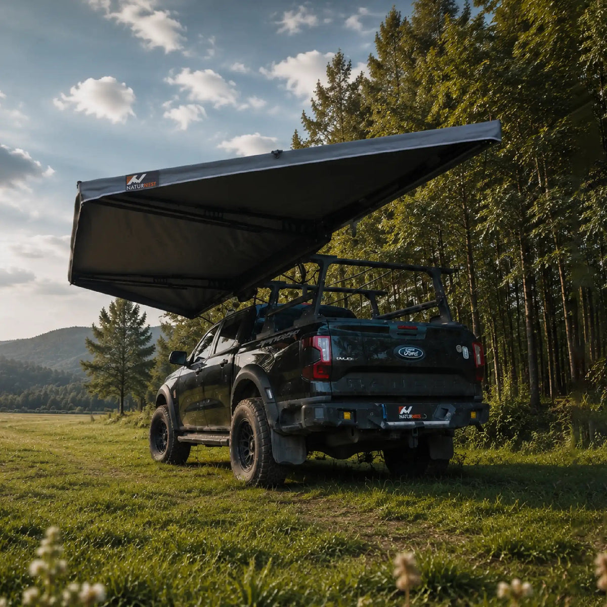 Naturnest 180 Awning deployed freestanding over a pickup truck, rear view