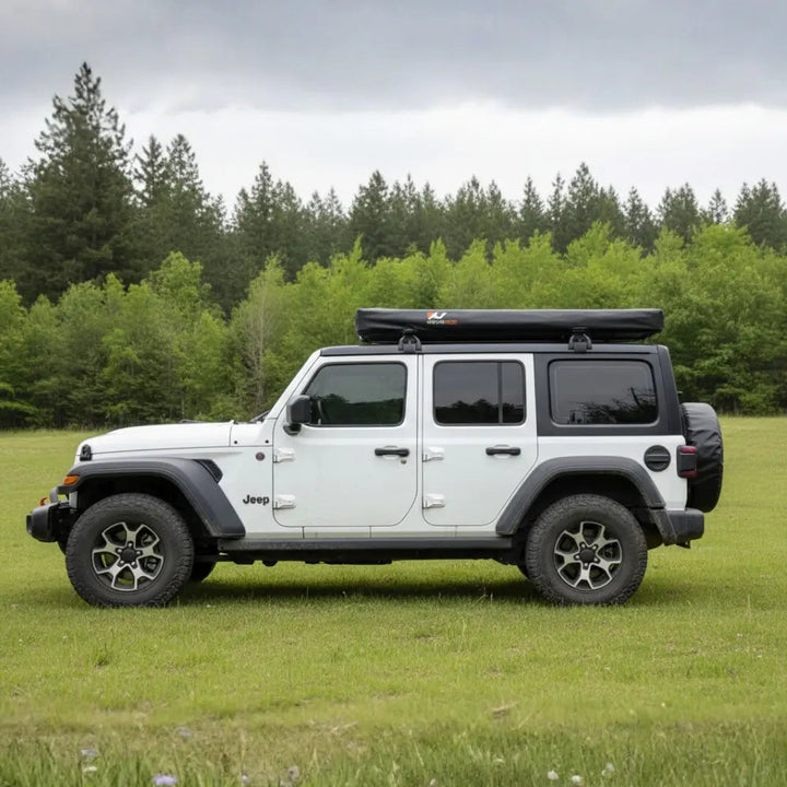 Naturnest Polaris Rooftop Tent Cover fitted on a rooftop tent, side view of a Jeep