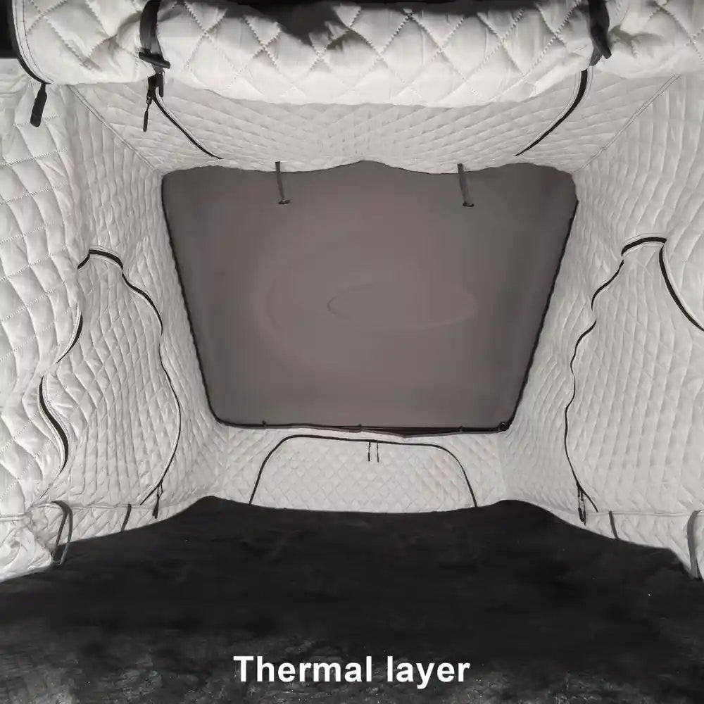 Naturnest Sirius 1 Plus XL Thermal Layer installed inside a rooftop tent, quilted interior