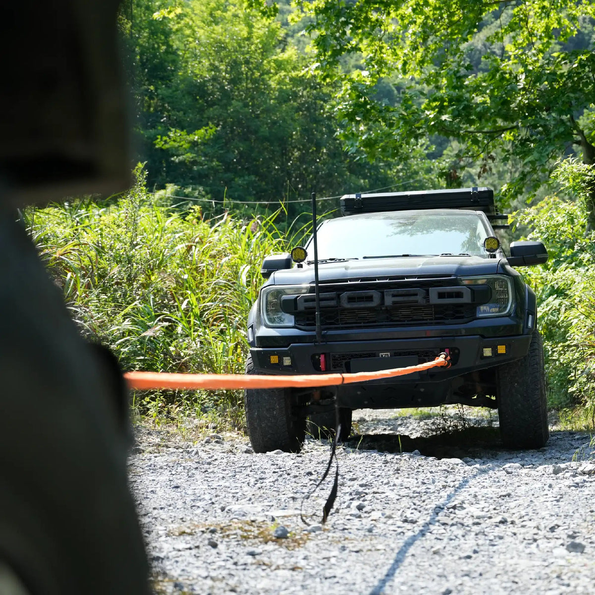 Naturnest Recovery Rope in use recovering a truck on a rocky trail