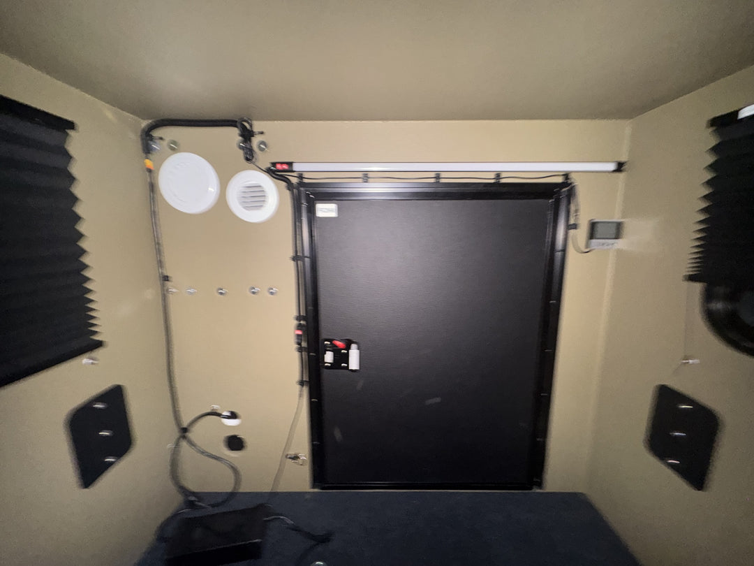 Pre-Owned Freedom Camper 58x79 Tan - interior view toward the rear door