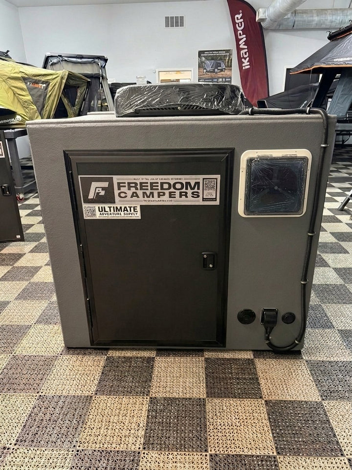 Freedom Camper 58x89 Ultimate Package Gray - front view of the built unit with rooftop air conditioner