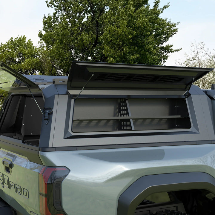 OPENROAD truck cap storage box loaded with gear behind the side window